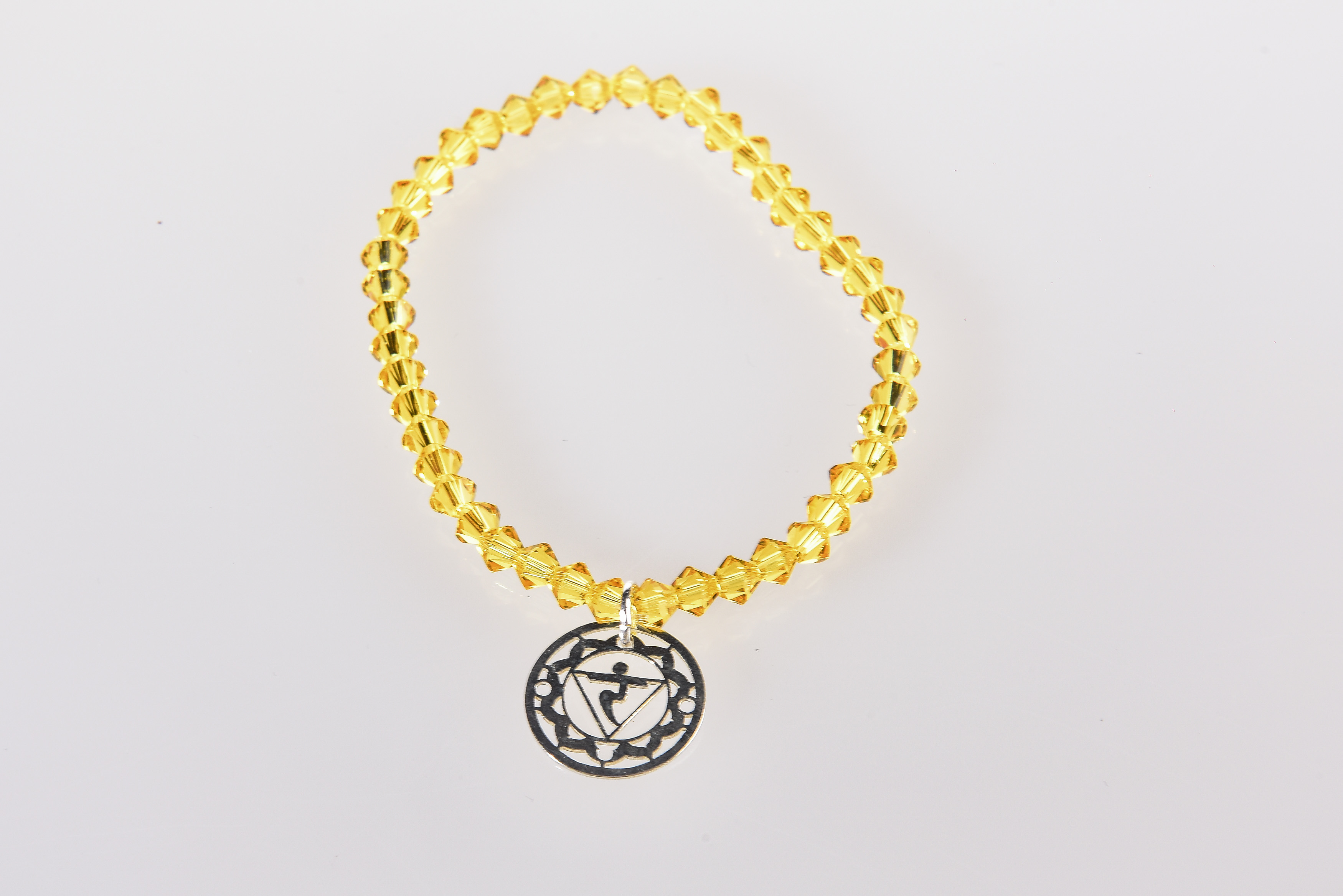 PULSERA  CRISTAL SWAROVSKI  CON CHAKRA PLATA MANIPURA ( AMARILLO )